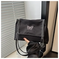Detail of butterfly embroidery on black canvas shoulder bag with silver metal chain - Black