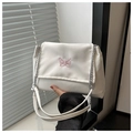 Close-up of pink butterfly embroidery on white chain shoulder bag with metal details - White
