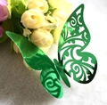 Detailed laser-cut emerald green 3D butterfly decoration on soft white texture - Reflective Green