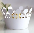 Detail of white laser-cut crown cupcake wrapper with delicate clover hollow patterns - White