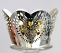 Detail view of silver laser-cut cupcake wrapper with heart patterns and gold foil chocolate - Reflective Silver