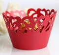 Detailed view of red laser-cut cupcake liner with heart pattern and gold chocolate - 5cm / Pearlescent Red