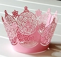 Detailed laser-cut pink paper cupcake wrapper with intricate snowflake and star patterns - Rose Red