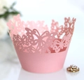 Close-up of pink laser-cut butterfly cupcake wrappers made of premium pearlescent paper - 5cm / Pink