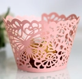 Intricate pink laser-cut cupcake wrapper with hollow butterfly and floral lace design - Pink