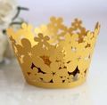 Macro detail of gold flower laser-cut cupcake wrapper with pearl paper metallic finish - 5cm / Gold Yellow