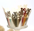 Macro detail of laser-cut butterfly cupcake wrappers with metallic gold reflective finish - Reflective Silver