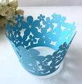 Close-up of sky blue laser-cut cupcake wrappers with intricate floral patterns for weddings - 5cm / Sky Blue