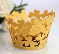 Golden clover lace cupcake wrapper with metallic finish for festive party chocolate decor - Gold