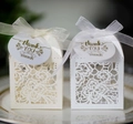 Detail of laser-cut floral wedding favor boxes with organza ribbons and thank you tags - White (With Thank You Tag)