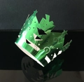 Detail of laser-cut green metallic Christmas tree cupcake wrapper with hollow design - Reflective Green