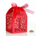 Elegant red laser-cut wedding favor box featuring a decorative satin ribbon bow - Pearlescent Red