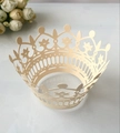 Detail of laser-cut champagne gold crown cupcake wrapper with pearlescent hollow pattern - Jewelry Star Gold