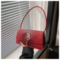 Detail of red croc-embossed leather bag with gold metal logo and fringe tassel charm - Red