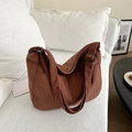 Detailed texture of brown corduroy hobo bag on a soft sofa with retro aesthetic style - Dark Brown Without Pendant