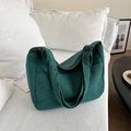 Detail of dark green corduroy tote bag showing soft ribbed texture and side pocket - Dark Green No Charm