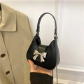 Chic black mini crescent handbag with oversized silver metal bow and chain strap - Black