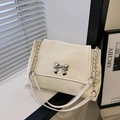 Elegant off-white chain tote bucket bag with metallic silver bow detail for women - White