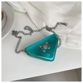 Detail of blue metallic triangle mini bag with bow clasp and silver chain strap - Green