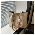 Detailed view of cream tote bag featuring khaki handles and cute pink plush charm - Khaki (With Charm)
