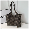 Detail of dark brown printed tote bag with matching hanging coin purse and gold hardware - Coffee