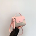 Pink leather and straw woven crossbody bag with top handle and adjustable strap - Pink