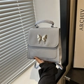 Chic light gray mini backpack with silver butterfly hardware and matte leather finish - Blue