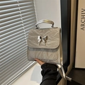 Silver metallic butterfly shoulder bag with pleated texture in a modern Y2K style - Gray