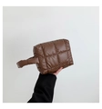 Detail of deep brown quilted nylon puffer tote bag with soft padded texture and top handles - Brown