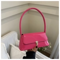 Macro detail of glossy pink patent leather handbag with premium silver metal clasp - Rose Pink