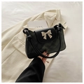 Fashionable black faux leather shoulder bag with bow detail and rhombus quilted pattern - Black