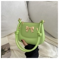 Fashionable apple green leather handbag with golden metal bow and woven knot handle - Green