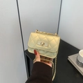 Mini gold quilted chain bag with metallic finish and metal turn-lock closure for women - Gold