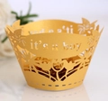 Detailed laser-cut gold cupcake wrapper with 'it's a boy' text for baby shower decor - Gold