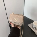 Elegant beige quilted mini crossbody bag with gold chain strap and metal swivel lock - Khaki