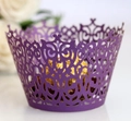 Macro detail of laser-cut purple cupcake wrapper with intricate lace pattern and chocolate - Dark Purple