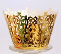 Detail of laser-cut gold cupcake wrapper with ornate European floral patterns - Reflective Gold