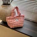 Chic light pink bubble textured tote bag with Love Fashion tag on wooden desk - Pink