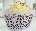 Detail of light purple laser-cut cupcake wrapper with elegant European scroll patterns - Light Purple