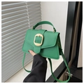 Detail of green lychee leather handbag with a golden woven square buckle and top handle - Green