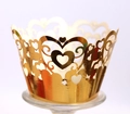 Detailed laser-cut golden cupcake wrapper featuring hollow heart and vine patterns - Reflective Gold