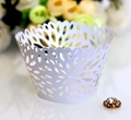 White laser-cut floral cupcake wrappers for elegant wedding cake and dessert table decor - White