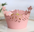 Close-up of pink laser-cut cupcake wrapper with bird and leaf patterns for weddings - 5cm / Pink