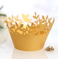 Laser cut golden cupcake liners with intricate bird and leaf design for elegant decoration - Gold
