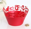 Close-up of red laser-cut lace cupcake wrapper with intricate floral hollow design - Pearlescent Red