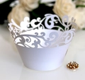 White laser-cut lace cupcake wrappers for weddings with elegant hollow floral pattern - White