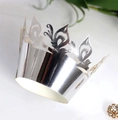 Close-up of silver laser-cut cupcake wrappers with elegant mirror finish patterns - Reflective Silver