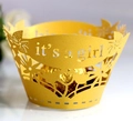 Macro detail of yellow laser-cut cupcake wrapper with it's a girl text and floral patterns - 5cm / Gold