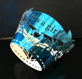 Close-up of laser-cut It's a Girl cupcake wrappers in metallic blue for baby showers - Reflective Blue / 5cm