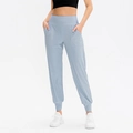 Women's high-waisted loose yoga sweatpants in light blue with side pockets - S / Bottoms / Light Blue